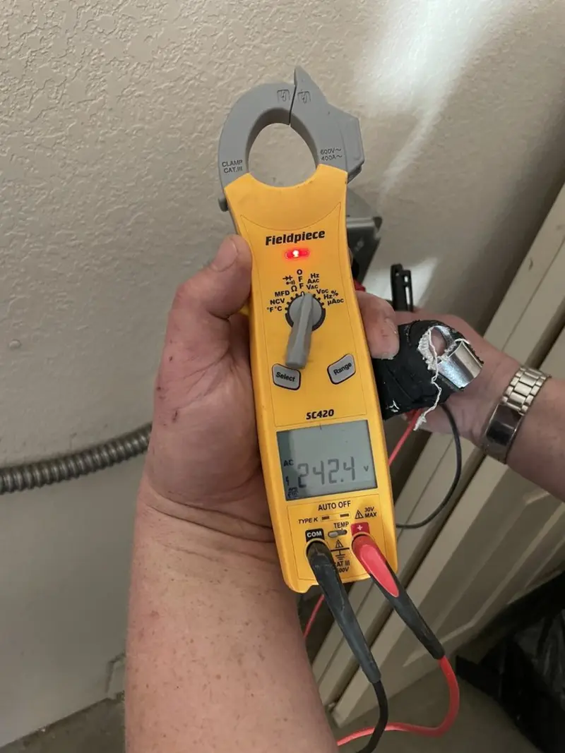 Voltage testing with clamp meter during Whole House Surge Protector in Columbiana